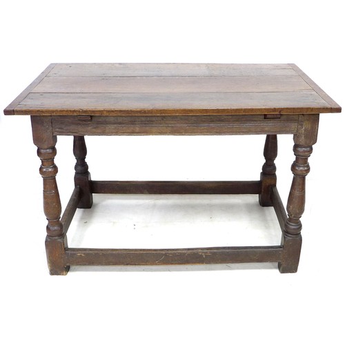 207 - A 17th century oak table, three plank rectangular top with breadboard ends, channelled freeze, raise... 