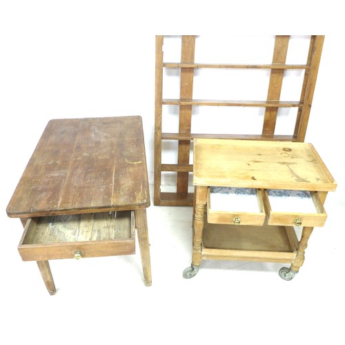 145 - A group of pine furniture, comprising a table with single drawer to one end, a trolley with single d... 