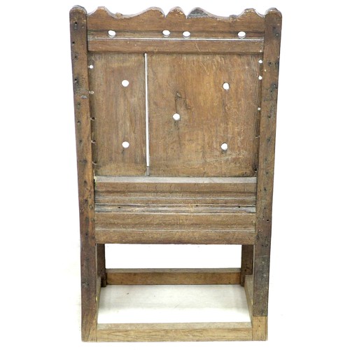 201 - A late 17th century oak Wainscot chair, with open shaped arms, later solid seat, single (split) pane... 