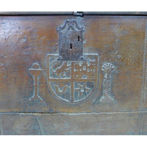 205 - A 17th century oak chest, metal lock plate, the front carved centrally with an heraldic crest, the f... 