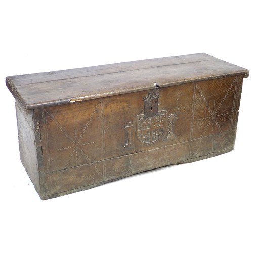 205 - A 17th century oak chest, metal lock plate, the front carved centrally with an heraldic crest, the f... 