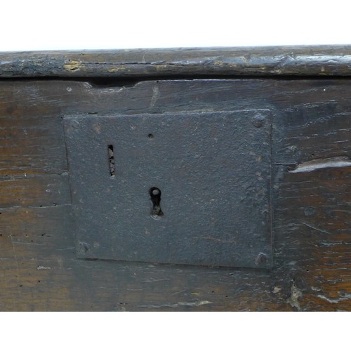 194 - A 17th century oak sword chest, metal lock plate, plain front, 114.5 by 44 by 62 cm high.