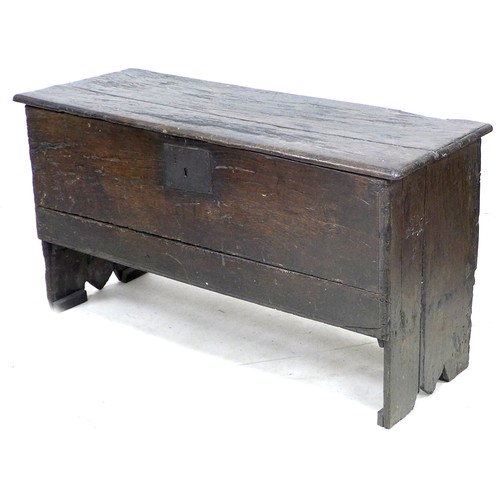 194 - A 17th century oak sword chest, metal lock plate, plain front, 114.5 by 44 by 62 cm high.