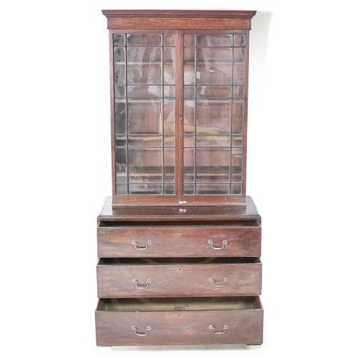 214 - A George III mahogany bookcase, twin astragal glazed doors enclosing four adjustable shelves, below ... 