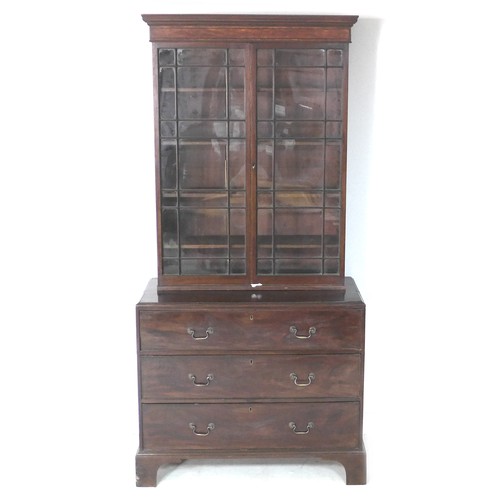 214 - A George III mahogany bookcase, twin astragal glazed doors enclosing four adjustable shelves, below ... 