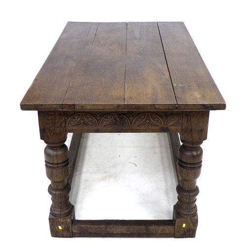 196 - A 17th century oak table, rectangular four plank surface, lunette carved frieze, heavy baluster turn... 