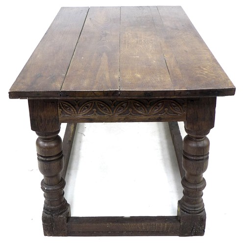 196 - A 17th century oak table, rectangular four plank surface, lunette carved frieze, heavy baluster turn... 