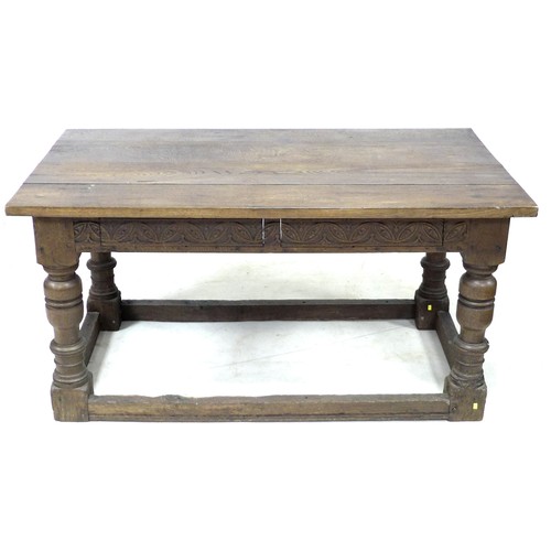 196 - A 17th century oak table, rectangular four plank surface, lunette carved frieze, heavy baluster turn... 