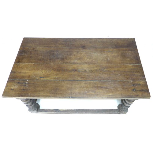 196 - A 17th century oak table, rectangular four plank surface, lunette carved frieze, heavy baluster turn... 