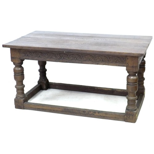 196 - A 17th century oak table, rectangular four plank surface, lunette carved frieze, heavy baluster turn... 