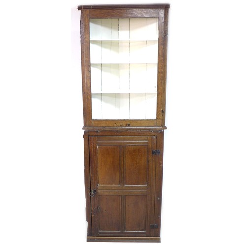 148 - A Victorian oak corner cupboard, three open shelves painted white, single door below, 38 by 72 by 21... 