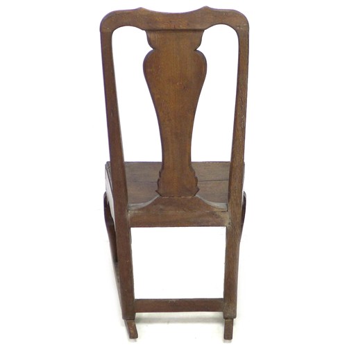 165 - An 18th century oak rocking chair, with shaped top rail, urn form back slat, solid seat, raised upon... 