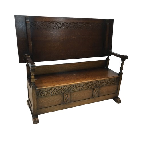 157 - An early 20th century oak monk's bench, 153 by 60 by 79cm (folded down), 153 by 54 by 124cm high (as... 