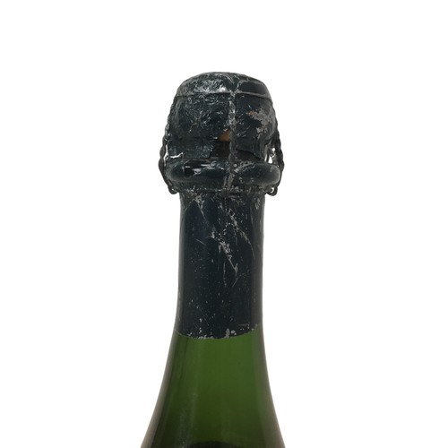 99 - Vintage champagne, a bottle of Moet & Chandon Cuvee Dom Perignon, vintage 1964, U: mid-shoulder, lab... 