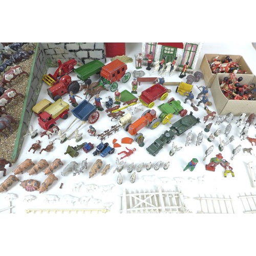 57 - A large collection of vintage toys, including diecast metal farmyard animals with a scratch built fa... 
