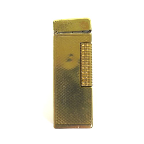 52 - Two vintage lighters, comprising a S.T. Dupont lighter Ligne, plaque argent G, diamond pattern, hous... 