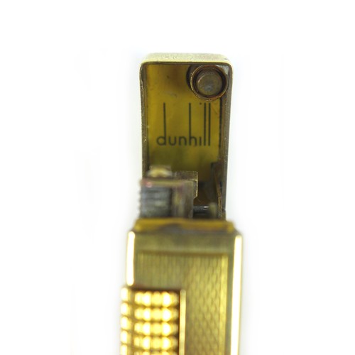52 - Two vintage lighters, comprising a S.T. Dupont lighter Ligne, plaque argent G, diamond pattern, hous... 