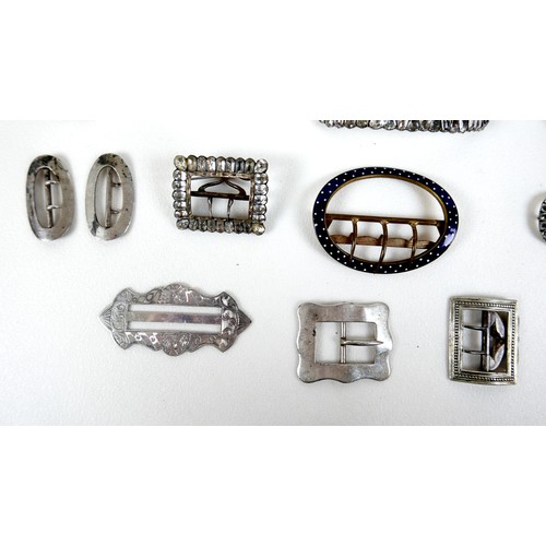 108 - A group of Georgian and later buckles, many paste set, including one large pair, one small pair, and... 