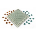 An Art Nouveau pottery draughts board and draughts, by Leeds Fireclay Co. Ltd , the square board dec... 