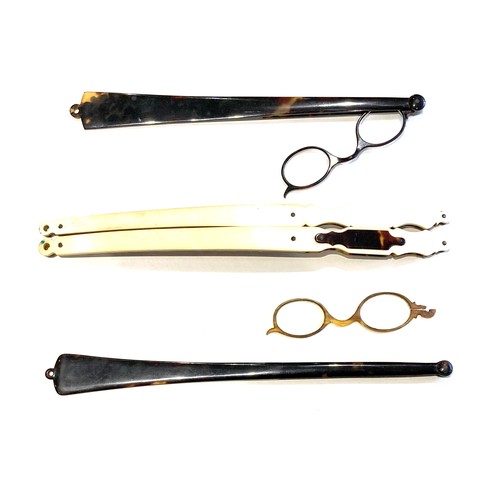 40 - A group of four long handled folding spectacles, a/f damaged, two with curved handles only, stamped ... 