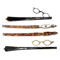 A group of four long handled folding spectacles, a/f damaged, two with curved handles only, stamped ... 