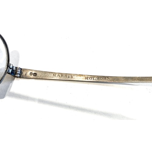 43 - A pair of 19th century silver folding spectacles, by Harris & Co, 50 Holborn, the frames with stampe... 