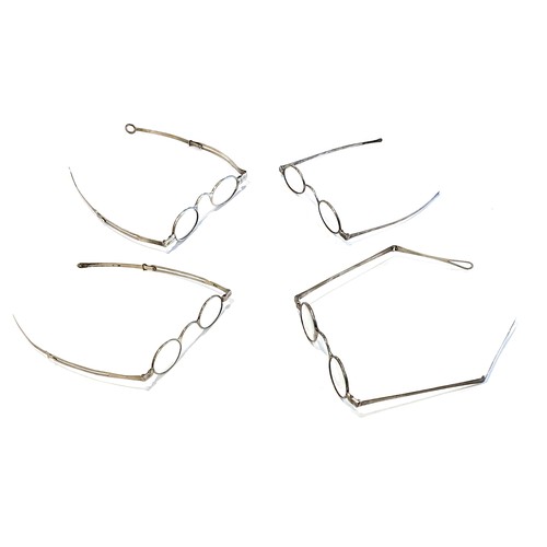 48 - A group of four 19th century silver and white metal folding spectacles, two stamped with hallmarks. ... 