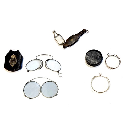 44 - A group of five 19th century folding spectacles and monocles, one in case stamped 'E. Lennie, Optici... 