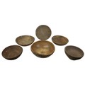 Five rustic wooden bowls, largest of walnut with metal mounted repairs, 43 by 15cm high, together wi... 