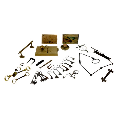 26 - A collection of 19th century and later keys and various door fittings, including locks, brass handle... 