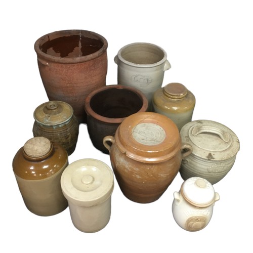 9 - Ten various stoneware storage jars and planters, including a large terracotta planter. (10)