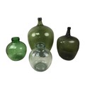 Four assorted glass carboys, including a 19th century example, 51cm high, and a large green glass ex... 