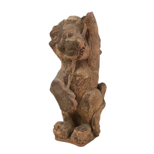 20 - A 19th century terracotta lion statue, 11 by 13 by 32cm high.