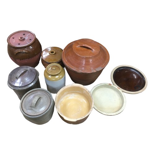 11 - Seven various stoneware storage jars and planters, together with two stoneware drip trays/bowls. (7)