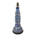 A Persian / Continental ceramic lamp base, wired for electricity in the early 20th century, decorate... 