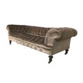 An early 20th century Chesterfield settee, with button back pale brown upholstery, raised upon turne... 