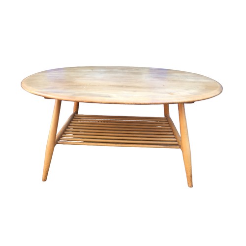 174 - An Ercol elm and ash oval form coffee table, 99.5 by 83 by 44cm high.