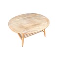 An Ercol elm and ash oval form coffee table, 99.5 by 83 by 44cm high.