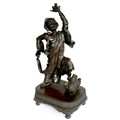 A late 19th century Japanese bronze sculpture, modelled as a man holding his left arm aloft, 48cm hi... 