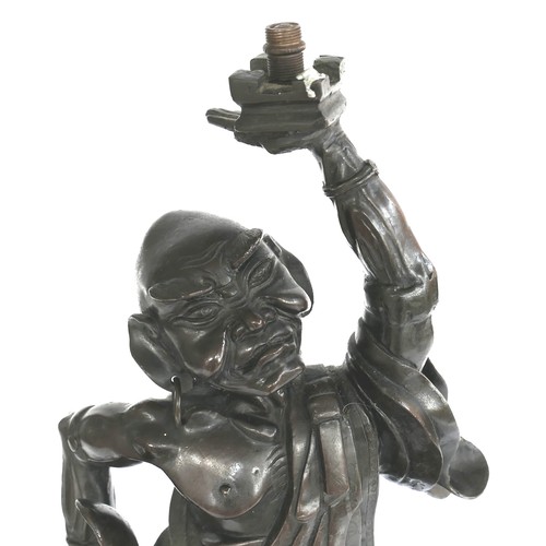 7 - A late 19th century Japanese bronze sculpture, modelled as a man holding his left arm aloft, 48cm hi... 