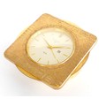 A Looping Swiss gilt brass 'World 'Time' desk alarm and calendar clock, retailed by 'Galli, Zurich',... 