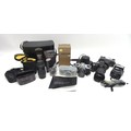 A collection of cameras and lenses, including a modern Leica C3 camera together with Praktika and Mi... 