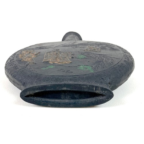 3 - A Chinese moon flask, early 20th century, black pottery with twin dragon handles, decorated in relie... 