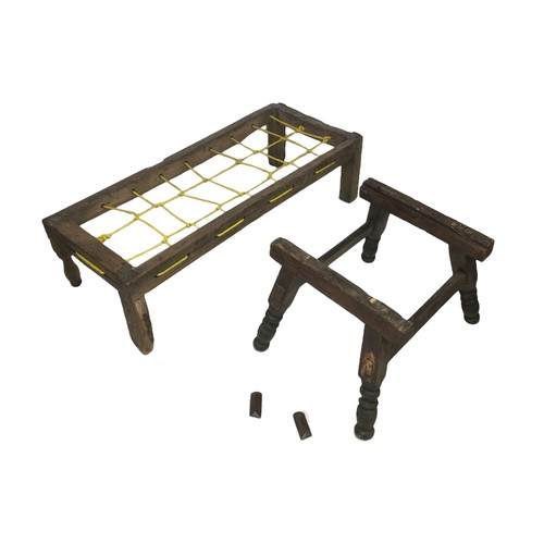 151 - A 17th century oak small bed frame, with modern rope base, with three style legs and one turned leg,... 