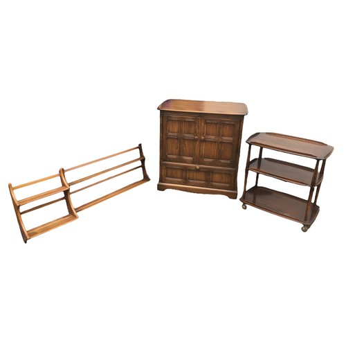 156 - A group of of Ercol furniture, all with a dark stained finish, comprising two sets of wall hanging s... 