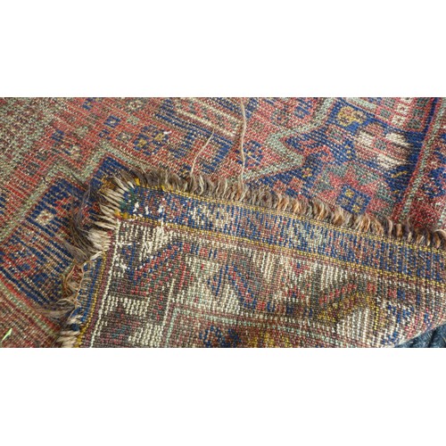 153 - Two early to mid 20th century rugs, comprising a blue ground rug, elongated hexagonal central medall... 