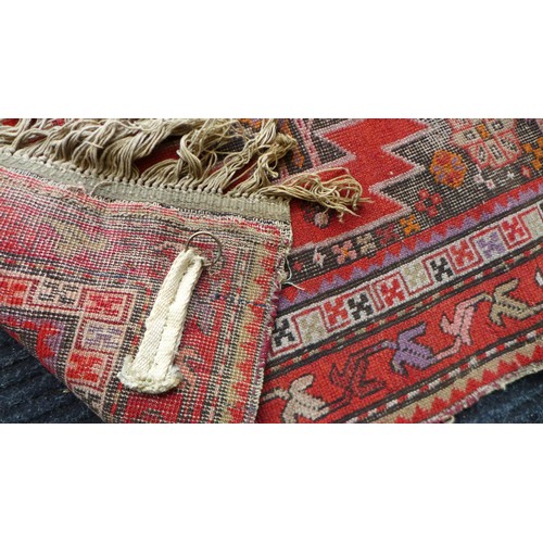 158 - Two prayer rugs, one with red ground, and diamond medallions and spandrels with serrated edge, 145 b... 