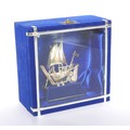 A modern 925 silver model of a sailing ship, 10cm high, in blue display case, 15.5 by 8 by 15cm high... 