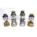 A group of four vintage paraffin lanterns, including a Hipolito H-502 Automatic, with Anchor 909 bas... 