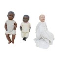 Three Early 20th century and later dolls, including an Armand Marseilles black bisque headed doll, w... 